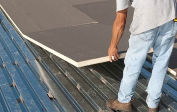 benefits of insulating Canford Magna flat roofing